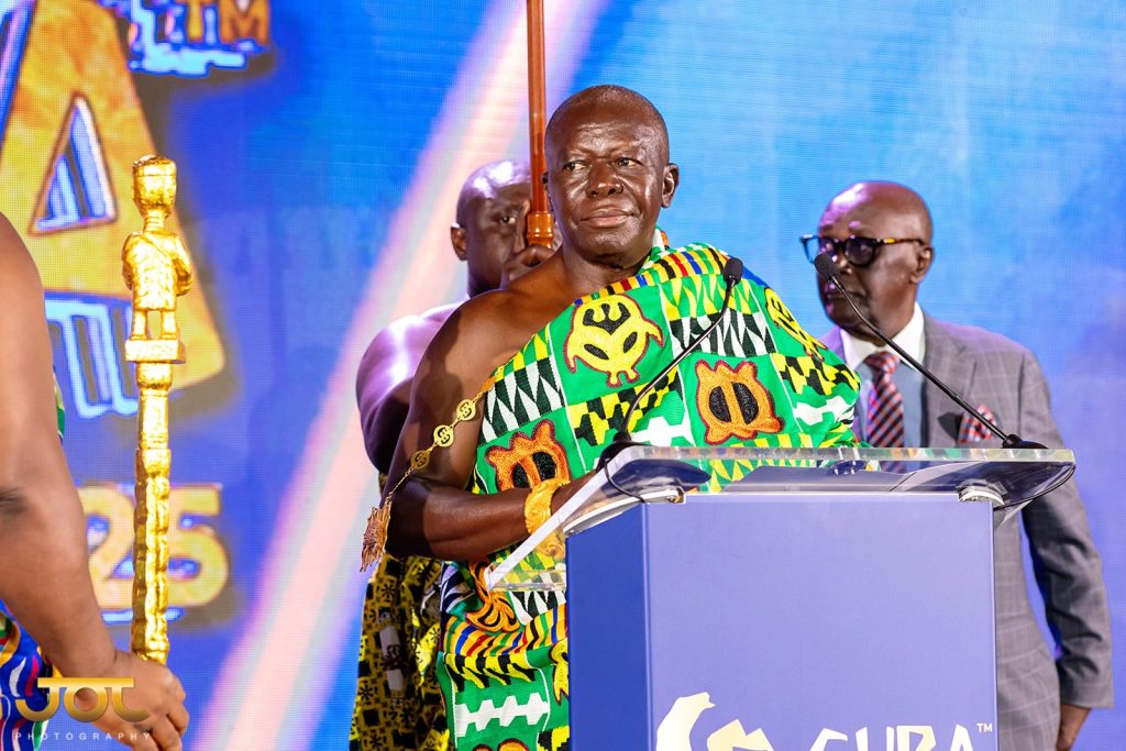ghanian man addresses from a podium