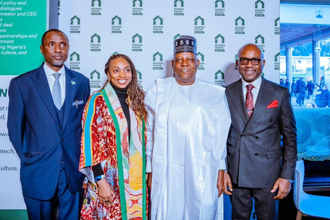 delegates pose for pictures at nigeria house in davos