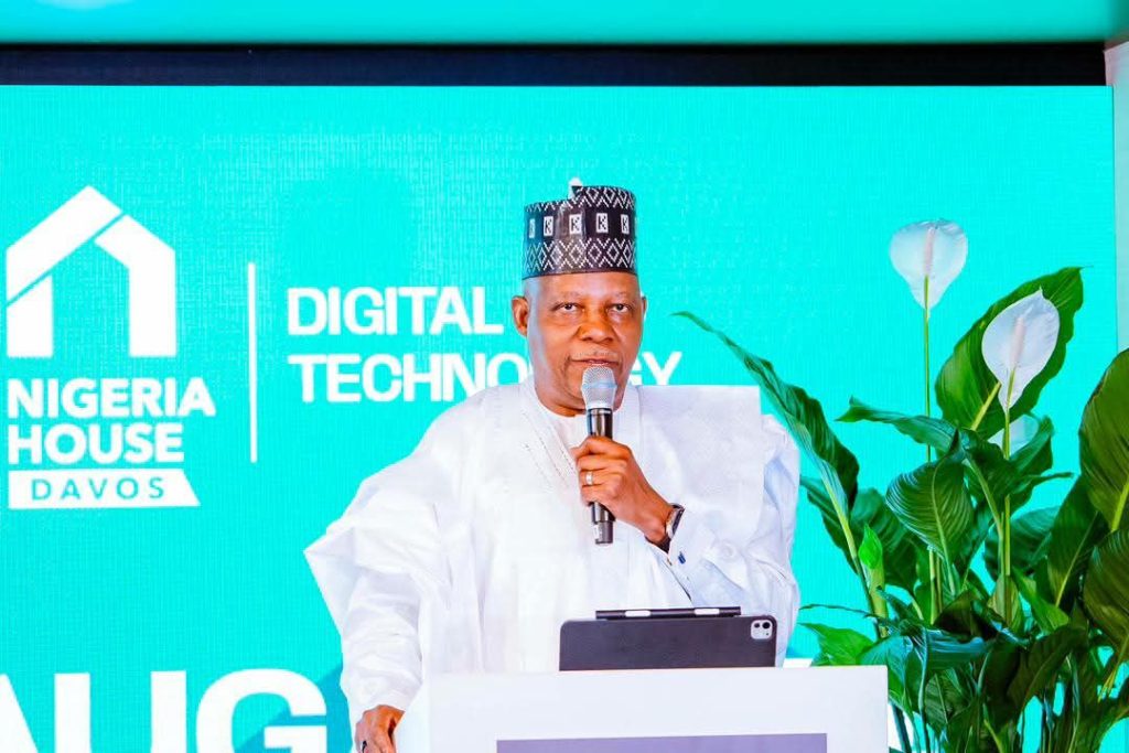 man in white nigerian wear at podium