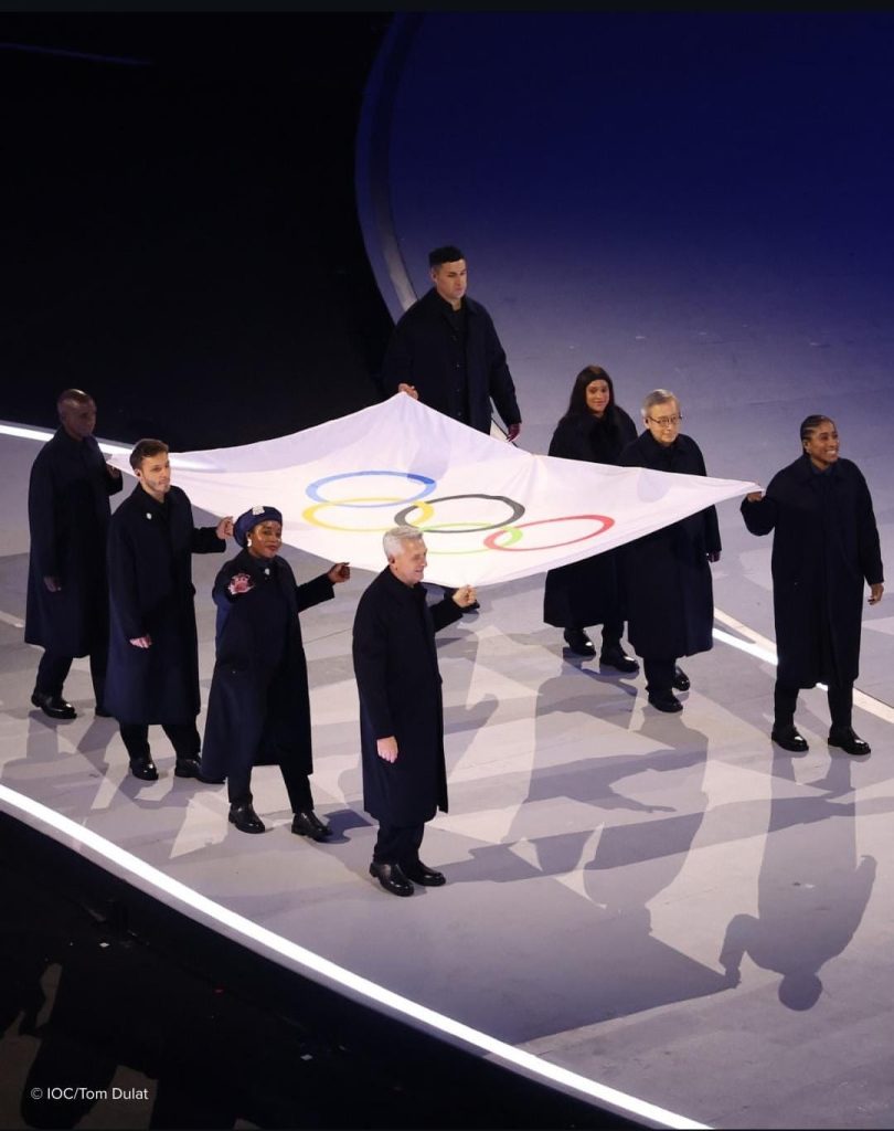 winter olympics carrying flag 2026
