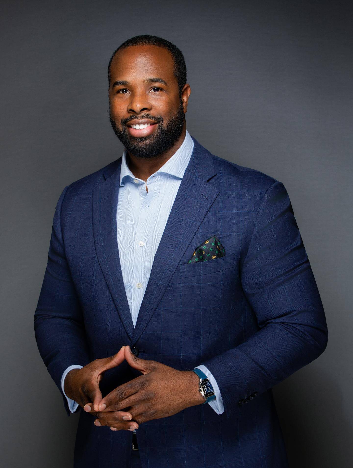 Professional portrait of Jason Coke, Contributing Editor at TIME Africa, wearing a navy blue suit, representing African thought leadership and economic innovation.