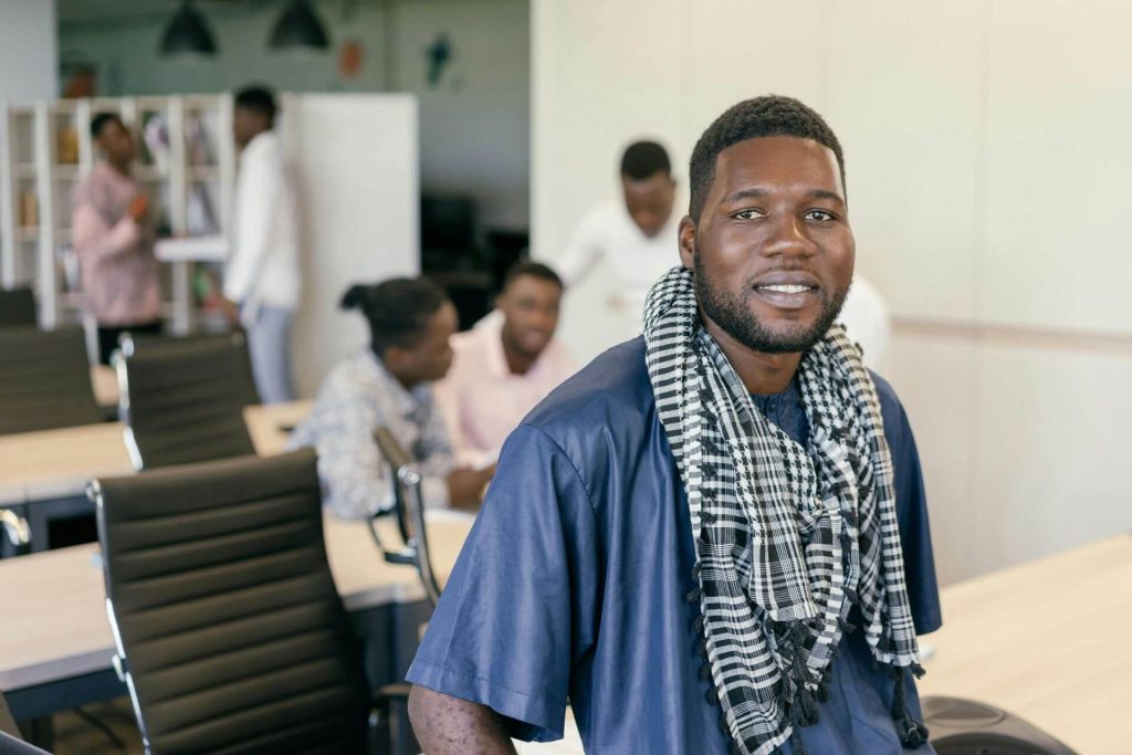 A young African entrepreneur in a modern office representing the Global Africa economic movement and Afreximbank’s Caribbean trade initiatives.