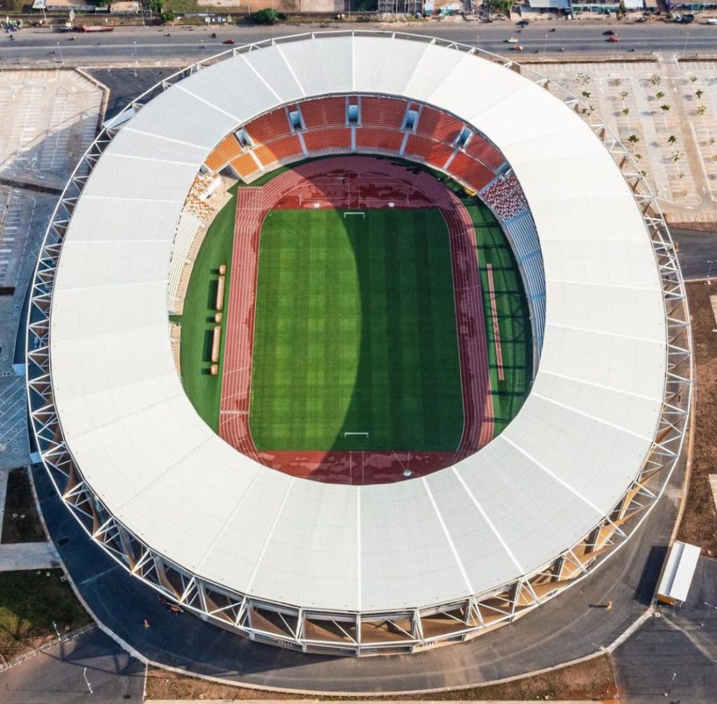 Aerial view of Stade de la Paix (Stadium of Peace) located in Bouaké, Ivory Coast, a modern circular football stadium in Africa, illustrating the infrastructure development attracting African football diaspora players.