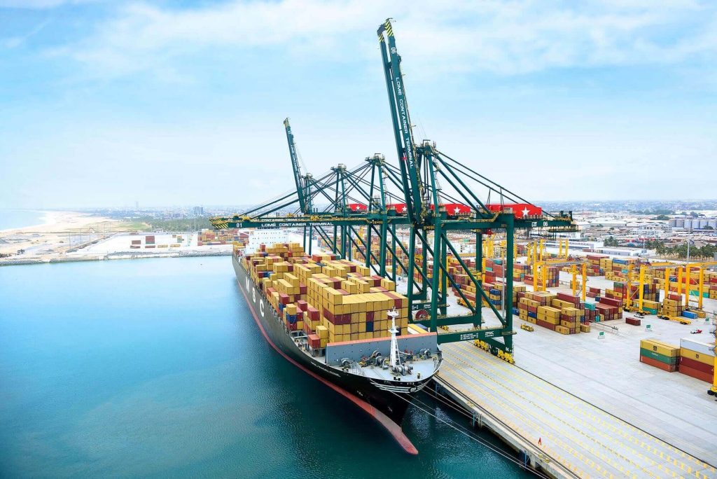 Aerial view of an MSC cargo container ship docked at the Lomé Container Terminal in Togo, representing West African maritime trade infrastructure and cross-border shipping logistics.