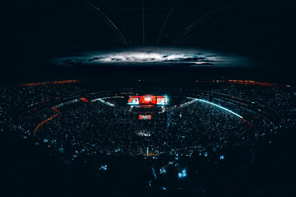 A nighttime view of FNB Stadium illuminated by lights, with a packed crowd enjoying Scorpion Kings Live. Photo: Mini Photography