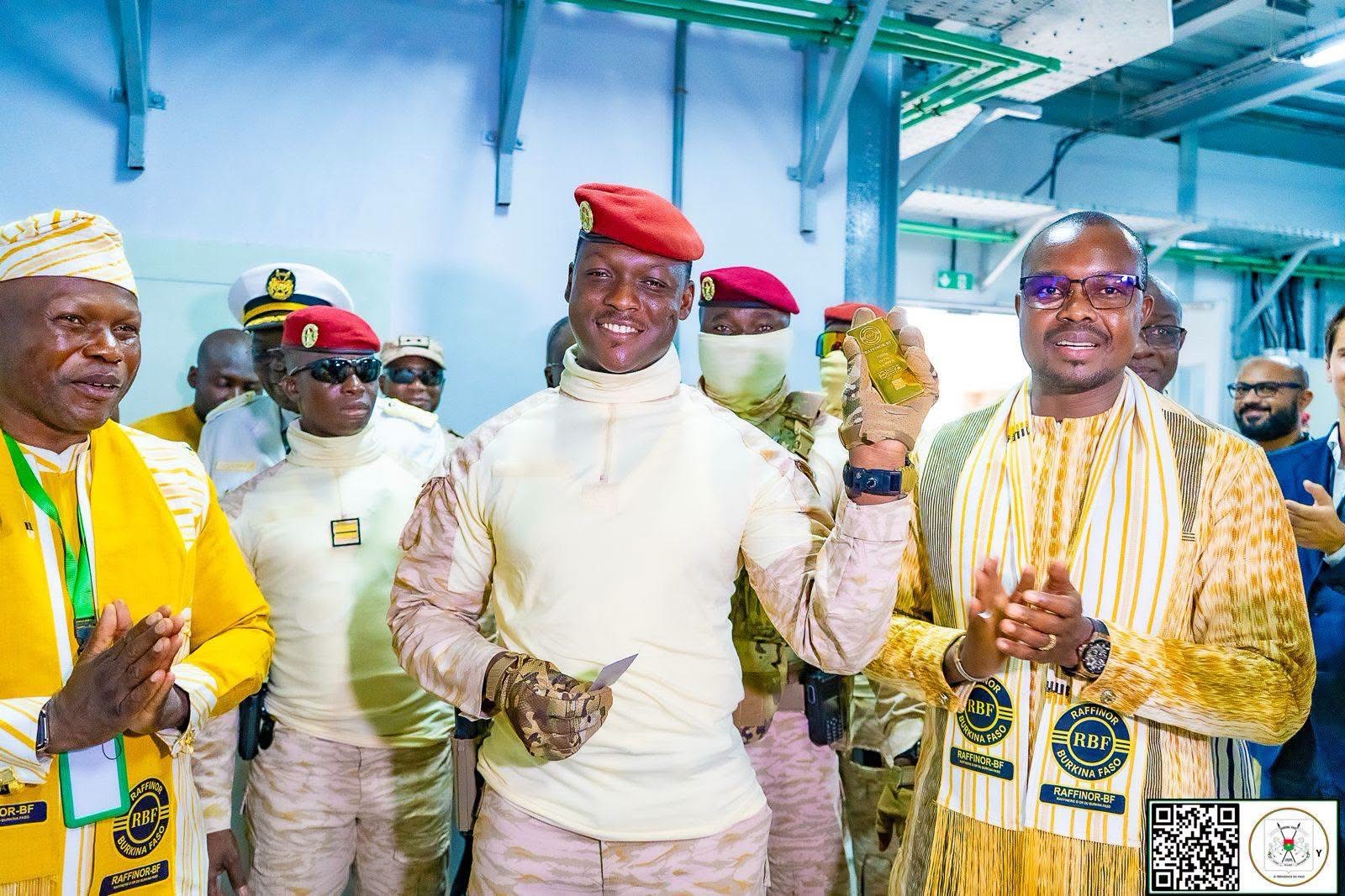 President of Burkina Faso, Captain Ibrahim Traoré holds a gold bar during the inauguration of the Raffinor-BF gold refinery in Ouagadougou.